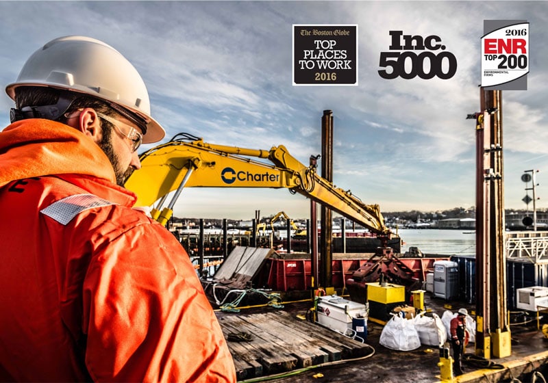 worker overlooking construction site on the water