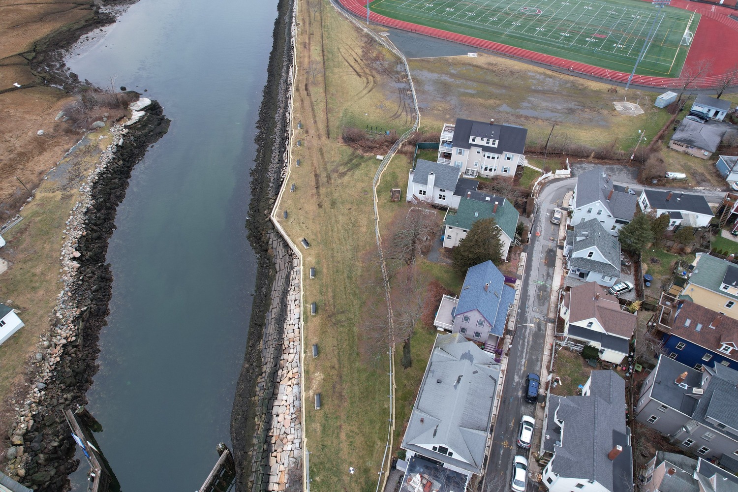 Sheet pile floodwall at Gloucester High School along the Annisquam River, Gloucester, Massachusetts